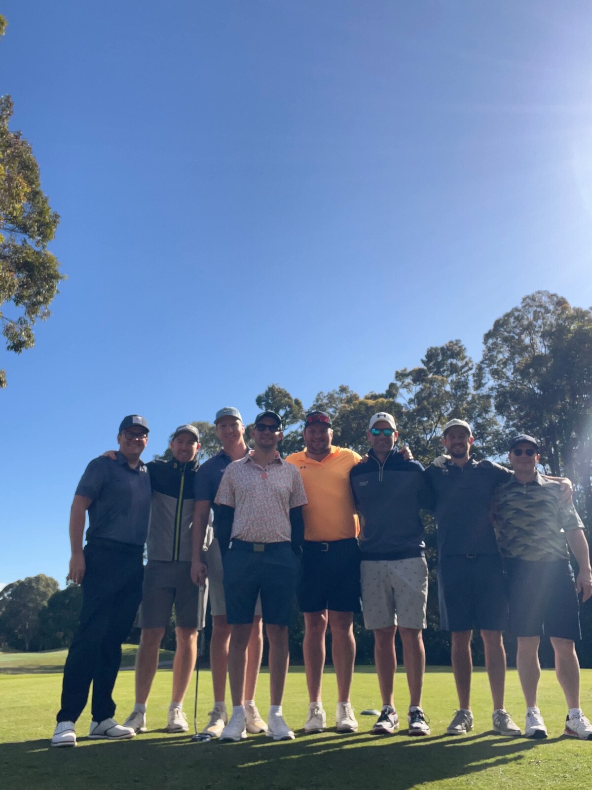 A group of golfers together on the course after a round